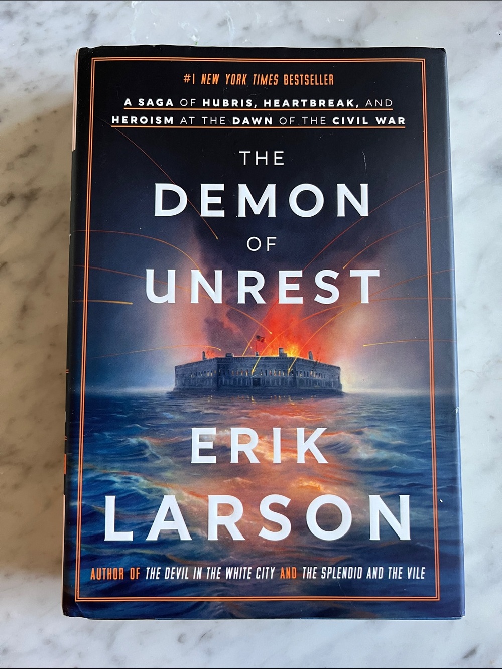 The Demon of Unrest by Erik Larson - Navy & Orange Hardcover